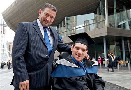 Image That Shows A Disabled Student With His Father During Graduation.