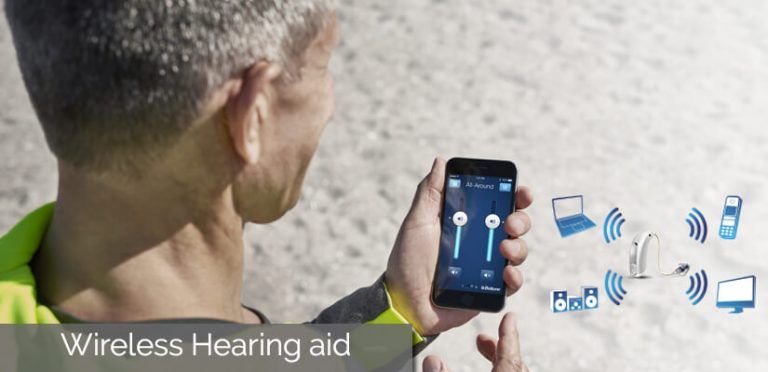 Image That Shows An Old Man Experiencing Wireless Hearing Aid Technology Over His Phone.