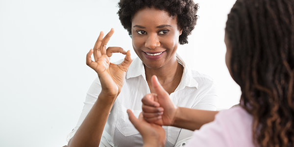 A Woman Speaking British Sign Language.