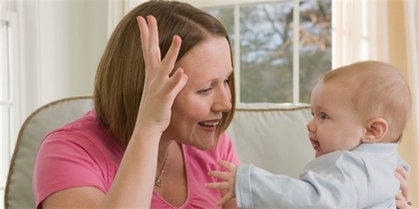 A Mother Talks With His Child By Uisng Sign Language.