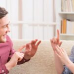 Two Persons Happily Shared Their Feelings With Sign Symbols.